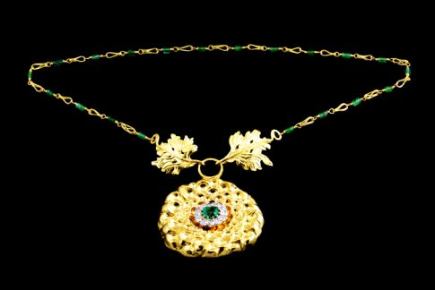 22K GOLD CHASING AND REPOUSSÉ CRYSANTHEUM FLOWER AND LEAVE CLASP ON HANDMADE 22K GOLD AND EMERALD NECKLACE. DIAMOND AND EMERALD RING TOP FROM CLIENT.